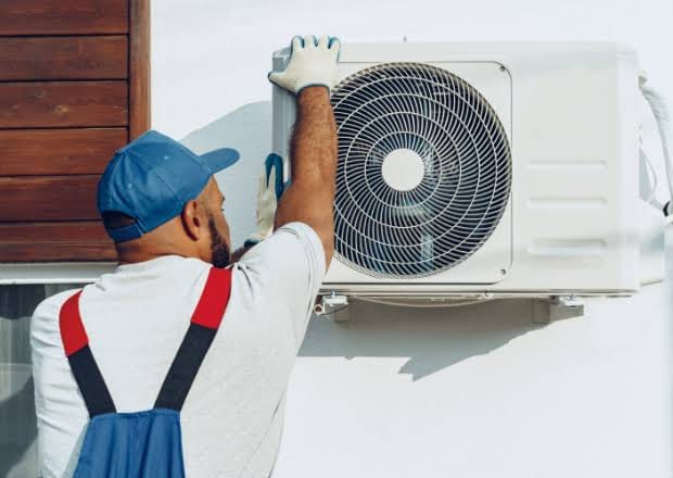 AC gas leak signs — ice buildup on the refrigerant line