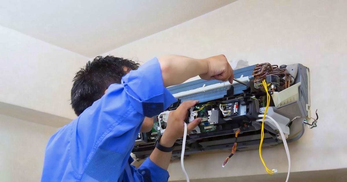 AC not cooling properly in Lahore home — technician checking the issue